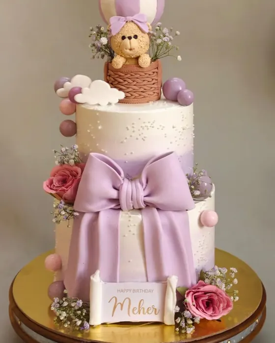 Two-tier teddy bear cake with a hot air balloon