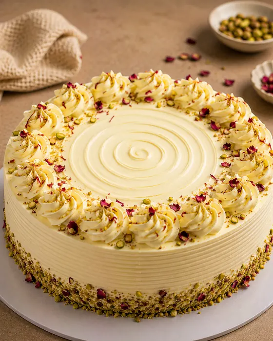 Rasmalai cake with pistachio and rose petals