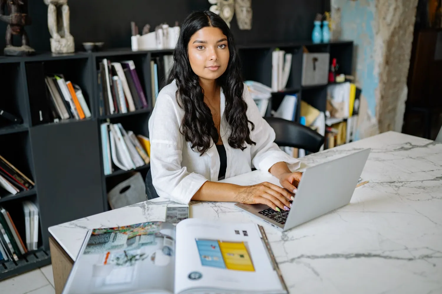 A young woman entrepreneur working at her desk