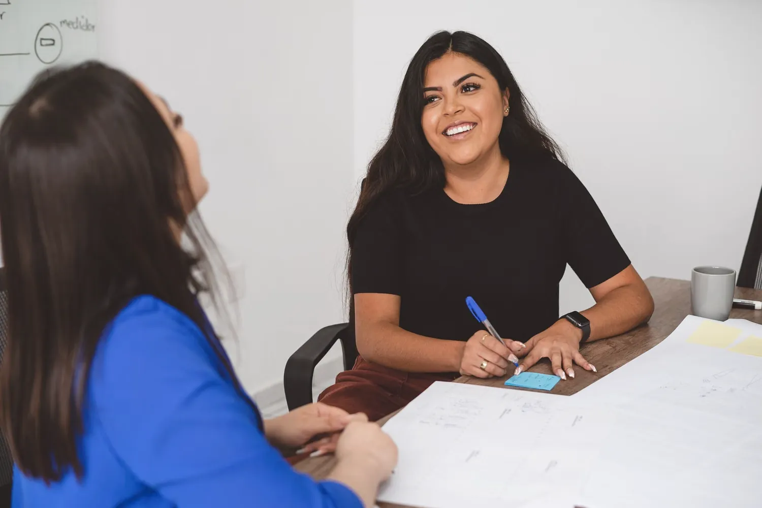 A smiling woman during a planning session