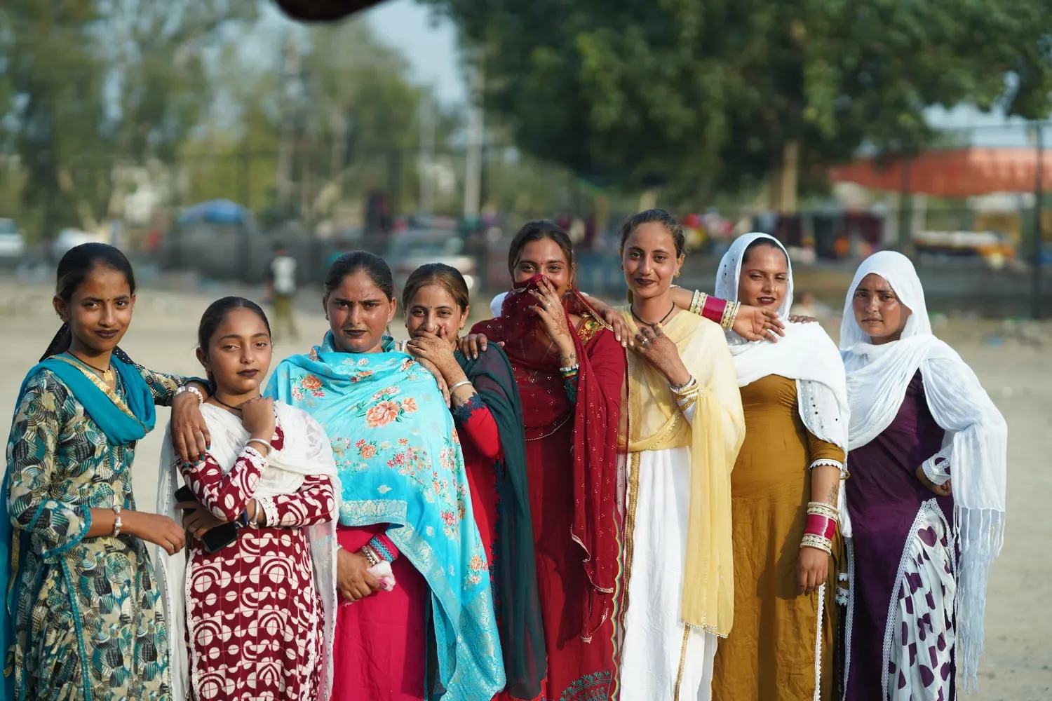 A group of women standing together, smiling